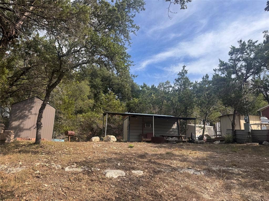 772 Rambling Drive, Canyon Lake, TX 78133 Tiny cabin currently on premises.