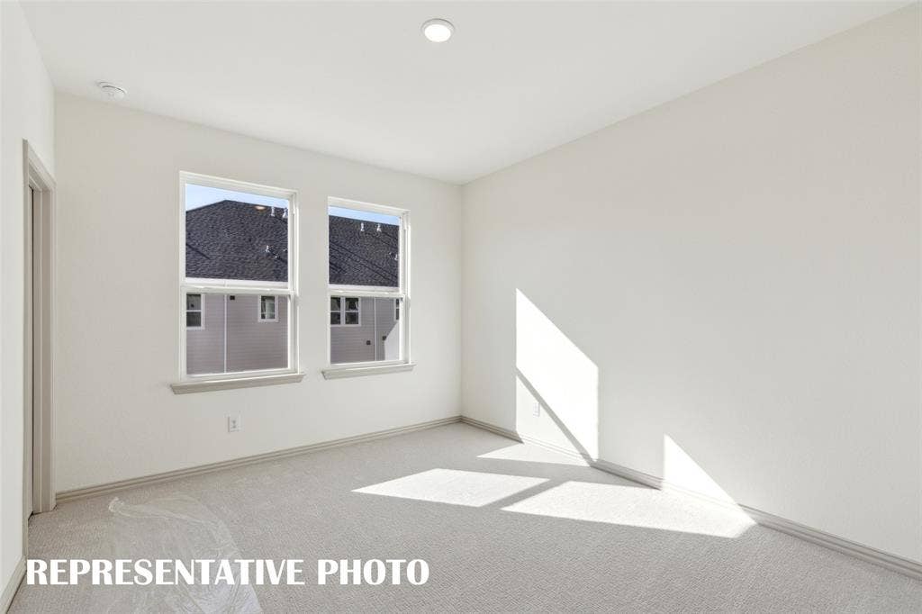 1401 Rooted Road, Frisco, TX 75033 One of two nicely sized secondary bedrooms offered in our Wyatt floor plan. REPRESENTATIVE PHOTO
