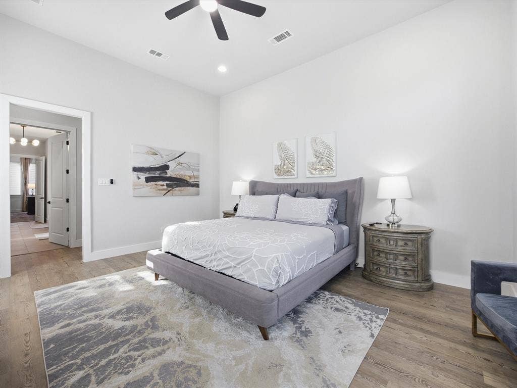 Bedroom with ceiling fan, light wood-style flooring, and recessed lighting