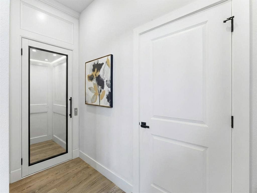 Virtually staged downstairs area off of Living Room where an elevator could be added.