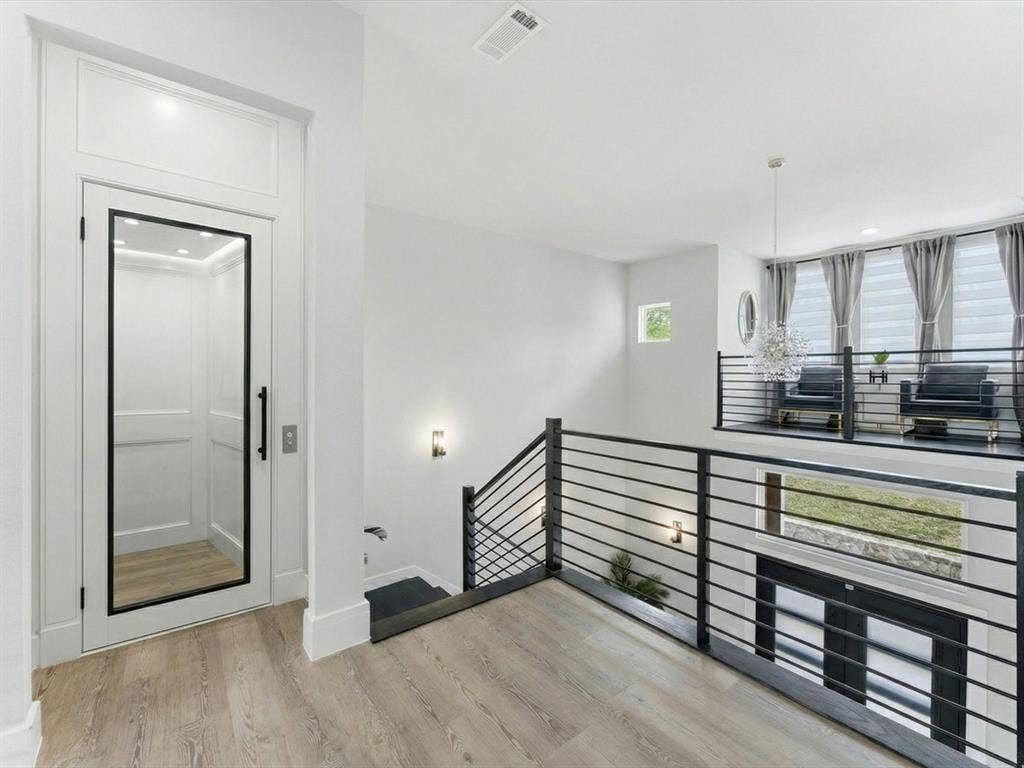 Virtually staged upstairs area where an elevator could be added.