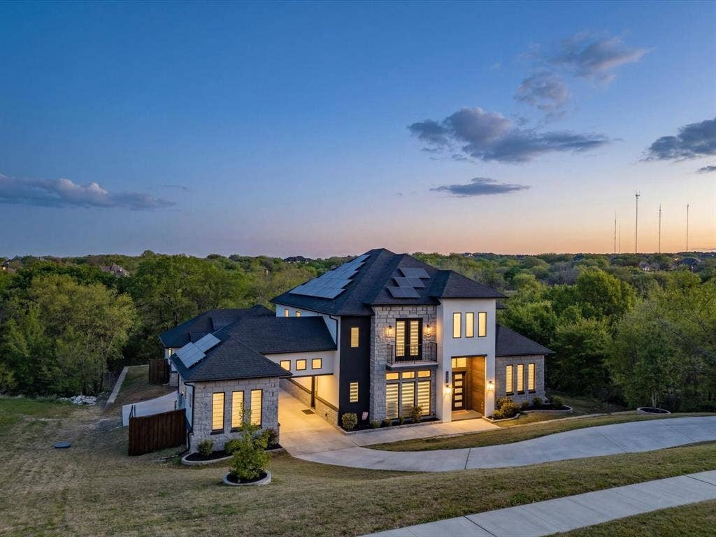 Contemporary house with stone siding and solar panels