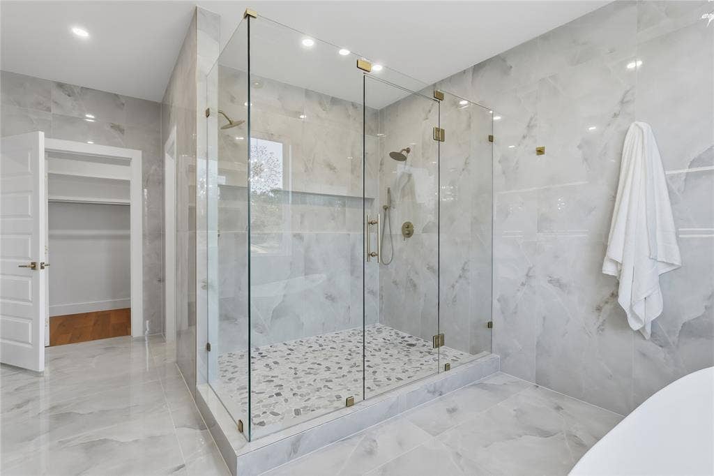 3424 Navaro Street, Dallas, TX 75212 Spacious walk-in shower with clear glass enclosure and gold-toned hardware