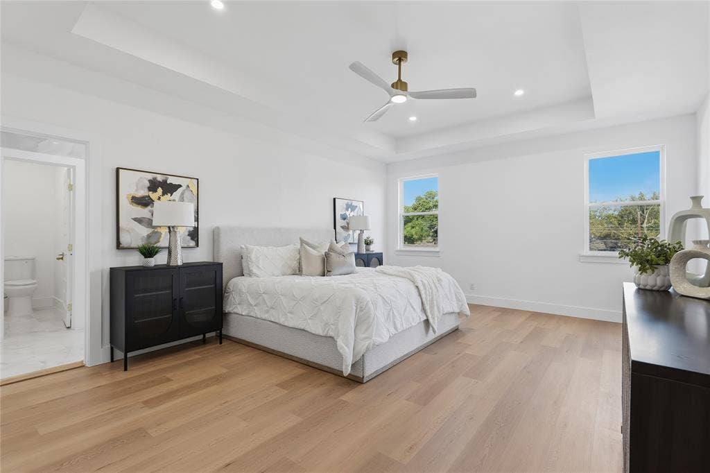 3424 Navaro Street, Dallas, TX 75212 Tray ceiling with recessed lighting, wood-finish flooring, and a ceiling fan