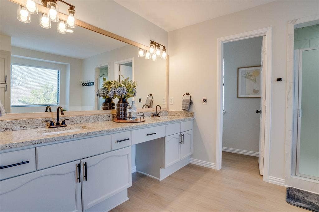 6003 Lloyd Court, Dallas, TX 75252 Dual vanity with granite-style countertops and undermount sinks