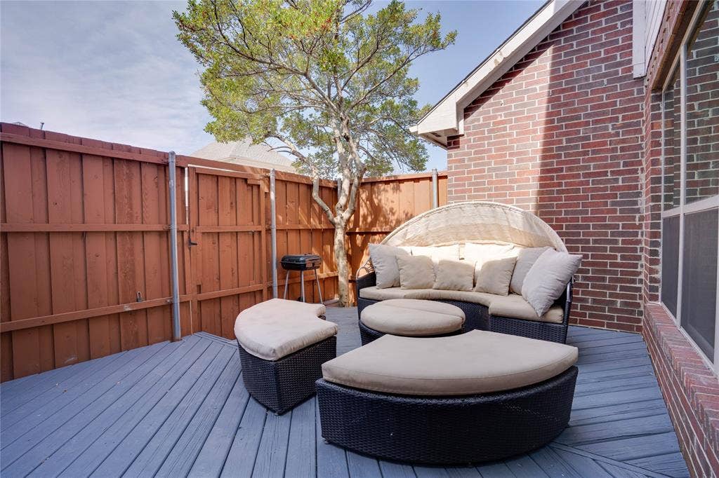 6003 Lloyd Court, Dallas, TX 75252 Private deck space featuring gray wood-finish flooring