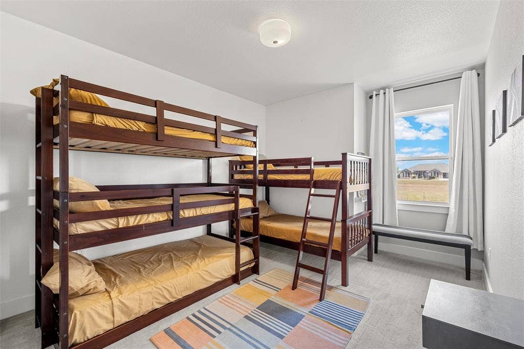 446 Wade Drive, Eddy, TX 76524 White walls, recessed window, trim molding, flush mount lighting, and gray carpeting (Bunk Room)