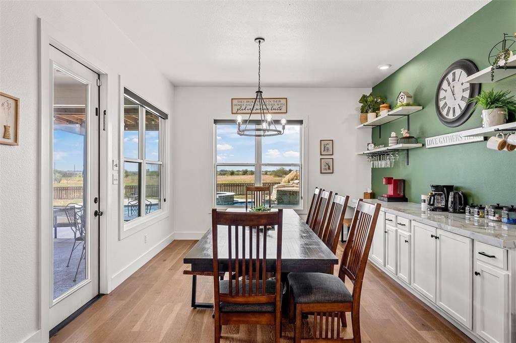 446 Wade Drive, Eddy, TX 76524 Wood-finish flooring throughout, with a large picture window, and glass-paneled patio door