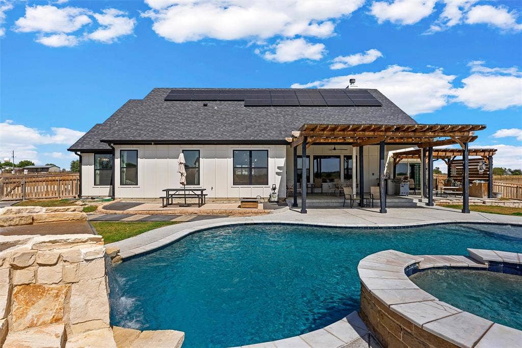 446 Wade Drive, Eddy, TX 76524 White board-and-batten exterior with black-framed windows