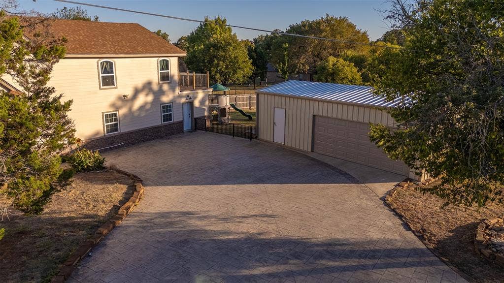 419 Sky Harbour Court, Granbury, TX 76049 Front of home including garage