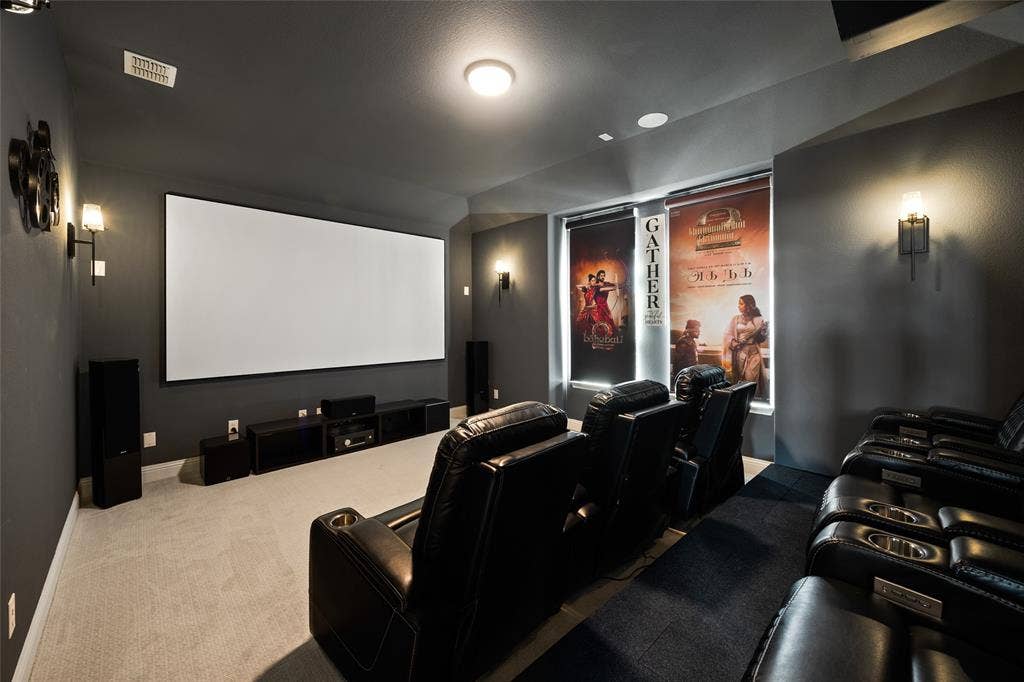 12512 Deer Trail, Frisco, TX 75035 Large projection screen, built-in media console, wall-mounted sconce lighting, recessed ceiling lighting, and carpeted flooring