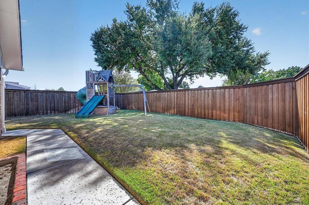 4448 Cleveland Drive, Plano, TX 75093 Room to play, garden and enjoy the outdoors, with a cedar privacy fence and a leafy backdrop of mature trees.