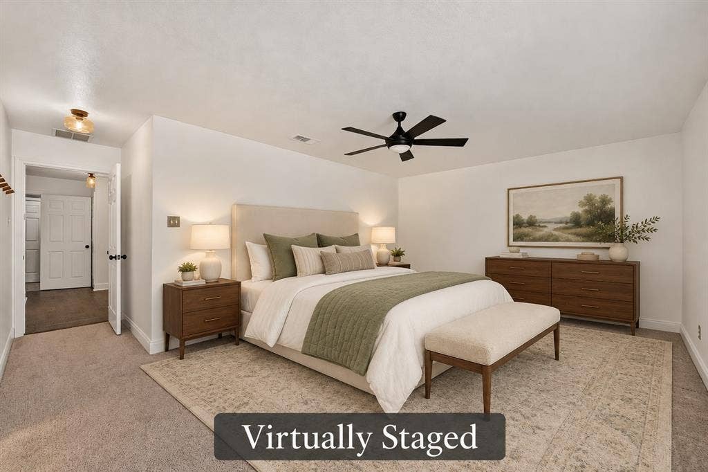 4448 Cleveland Drive, Plano, TX 75093 The spacious primary bedroom offers a soothing neutral palette, a ceiling fan and plenty of room to create your own restful retreat. Virtually staged.