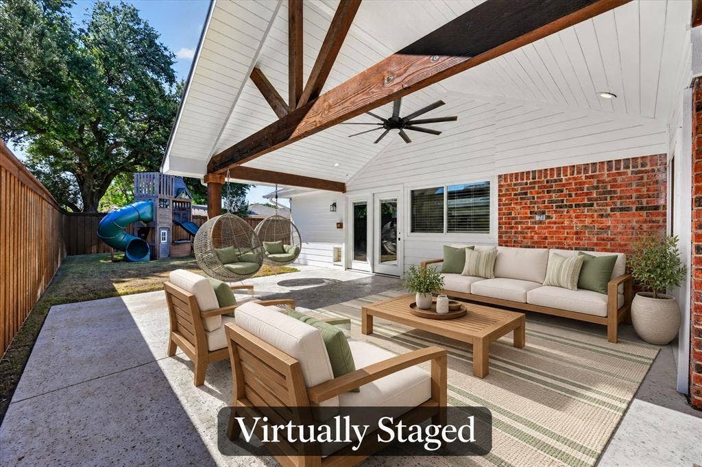 4448 Cleveland Drive, Plano, TX 75093 Relax or entertain on this spacious covered patio featuring beautiful wood beams, a vaulted ceiling, and backyard views. Virtually staged.