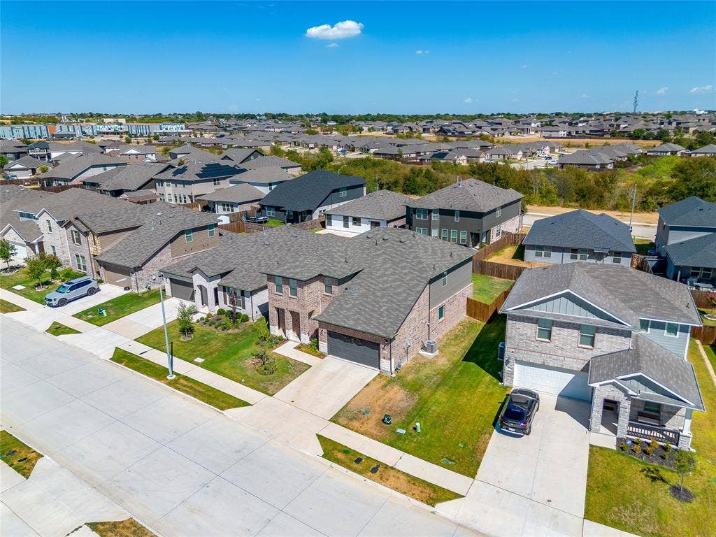 Expansive residential community featuring a variety of architectural styles, mature landscaping, and concrete driveways