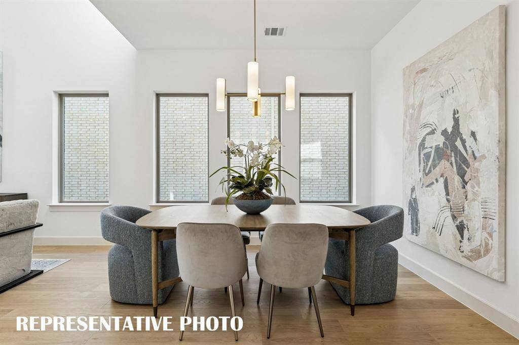 Whether it's lively dinner parties or cozy family get togethers, this light filled dining room fits all occasions!  REPRESENTATIVE PHOTO