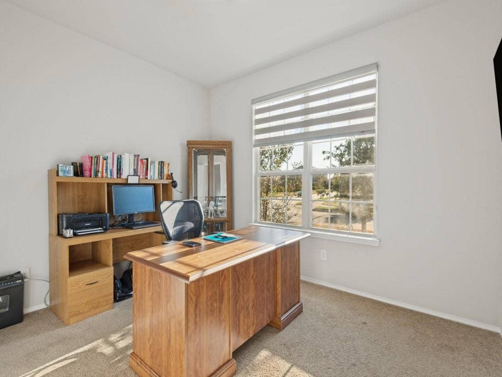 3825 S Courtney Court, Heartland, TX 75126 Brightly lit room featuring a large window with horizontal blinds