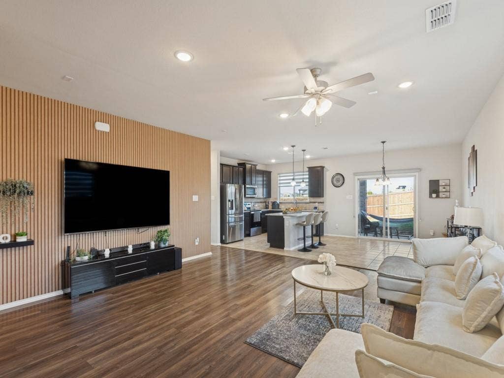 3825 S Courtney Court, Heartland, TX 75126 Wood-finish flooring throughout the living area