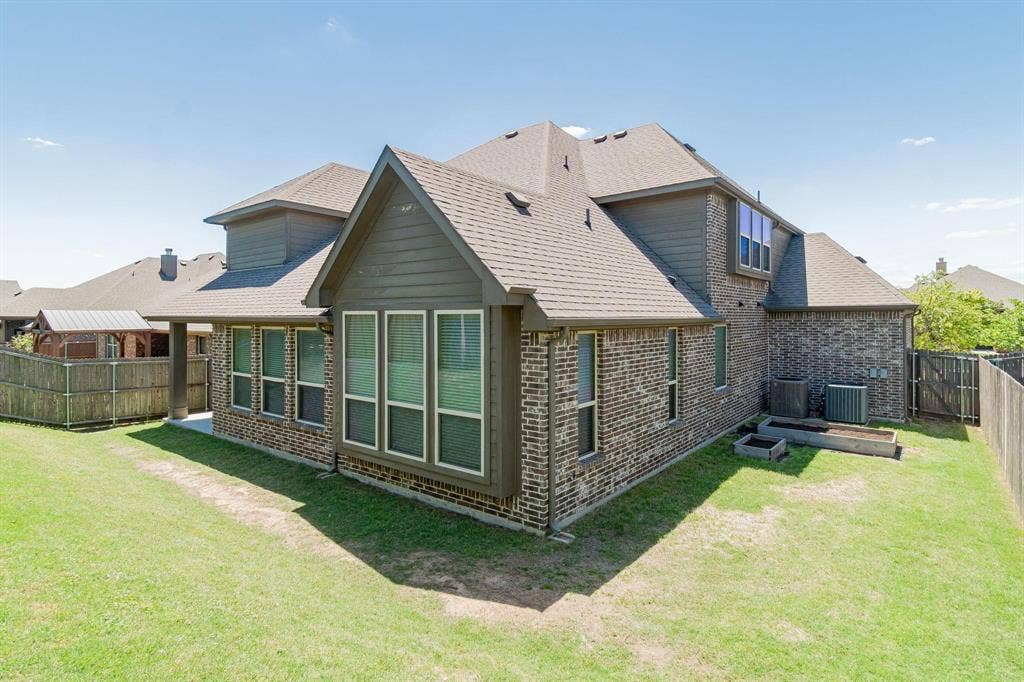 Brick and siding exterior with gabled roof lines
