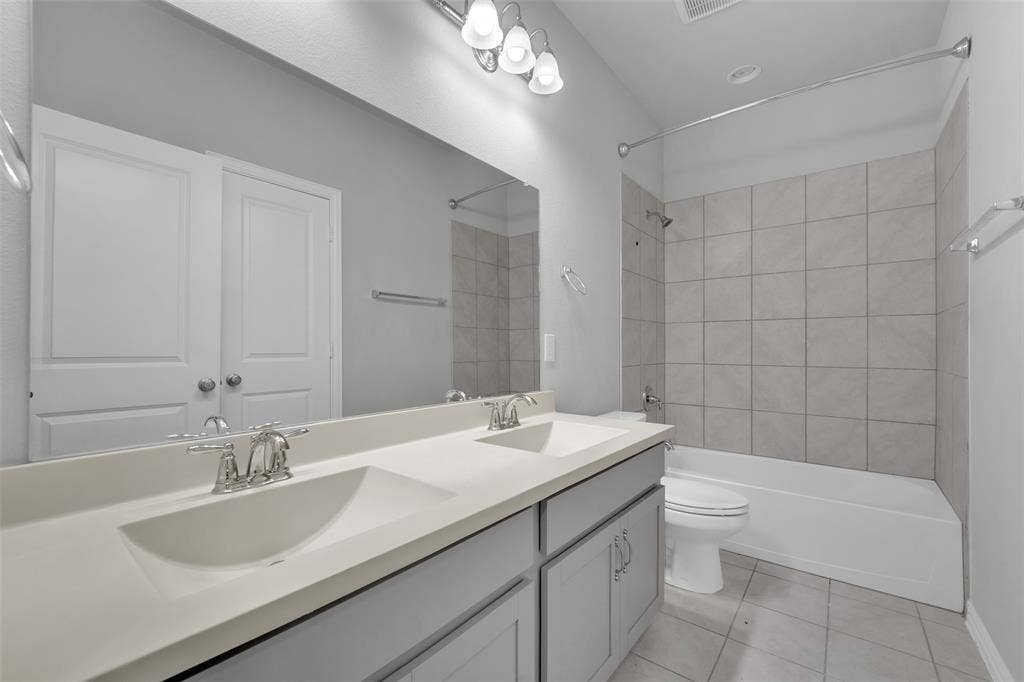 8266 Primrose Way, Dallas, TX 75252 Dual vanity with integrated sinks and chrome fixtures