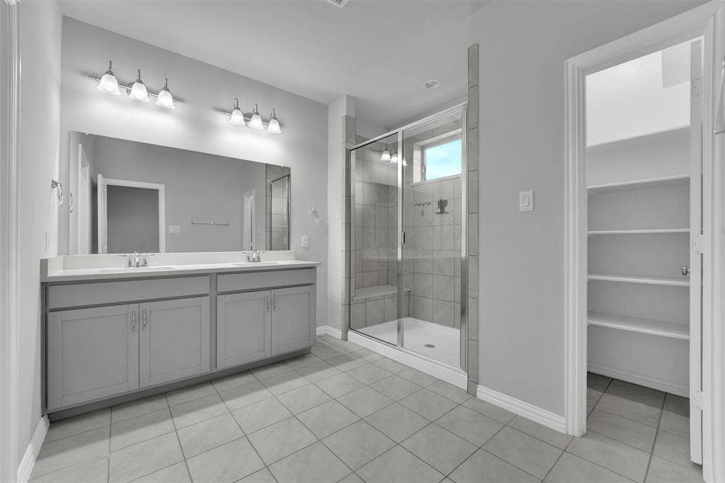 8266 Primrose Way, Dallas, TX 75252 Dual vanity with undermount sinks and light-colored countertops