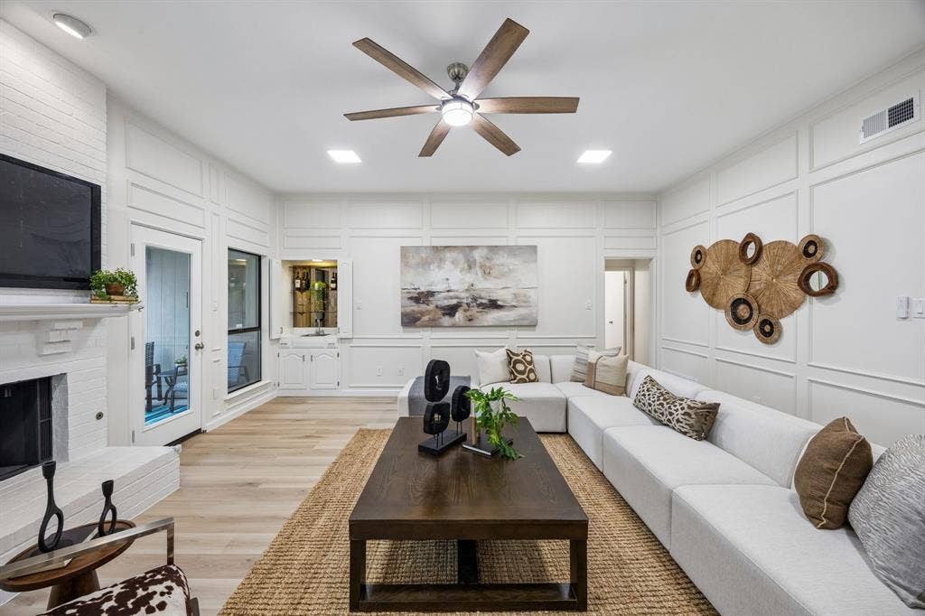 4540 New Orleans Drive, Plano, TX 75093 Living area featuring decorative wall paneling, wood-finish flooring, recessed lighting, and a ceiling fan