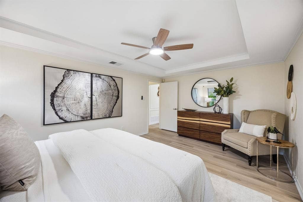 4540 New Orleans Drive, Plano, TX 75093 Recessed ceiling with crown molding, wood-finish flooring, and a ceiling fan with integrated lighting