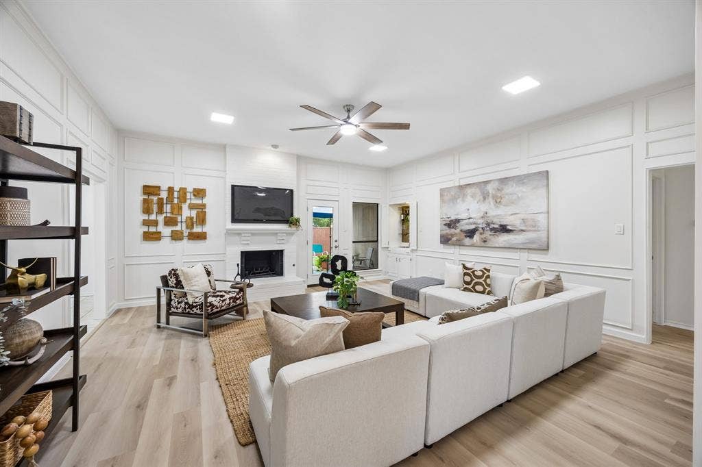 4540 New Orleans Drive, Plano, TX 75093 Open concept living space featuring wood-finish flooring and a ceiling fan
