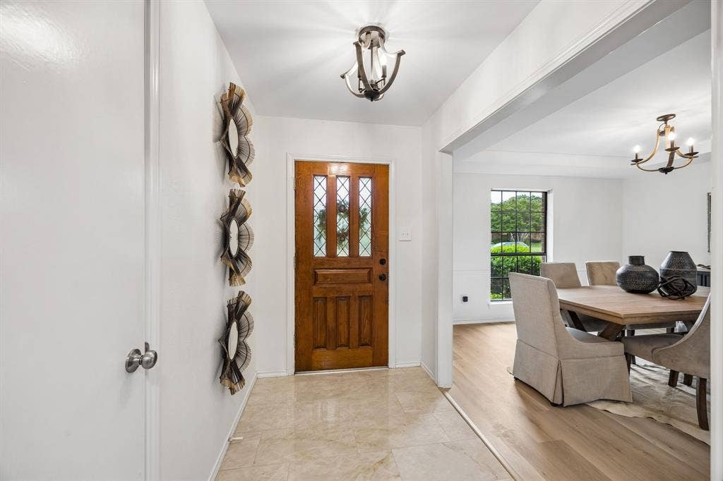 4540 New Orleans Drive, Plano, TX 75093 Warm wood-paneled entry door with leaded glass accents