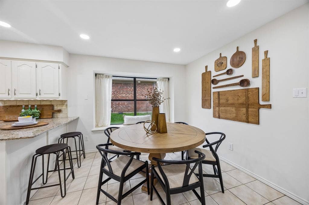 4540 New Orleans Drive, Plano, TX 75093 Recessed lighting, tile flooring, window with natural light, built-in breakfast bar, upper and lower cabinetry