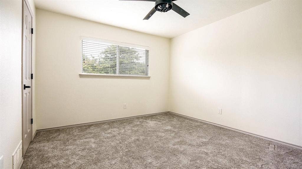 2616 Ellis Court, Plano, TX 75075 Plush carpet flooring, a window with horizontal blinds, and a ceiling fan with integrated lighting
