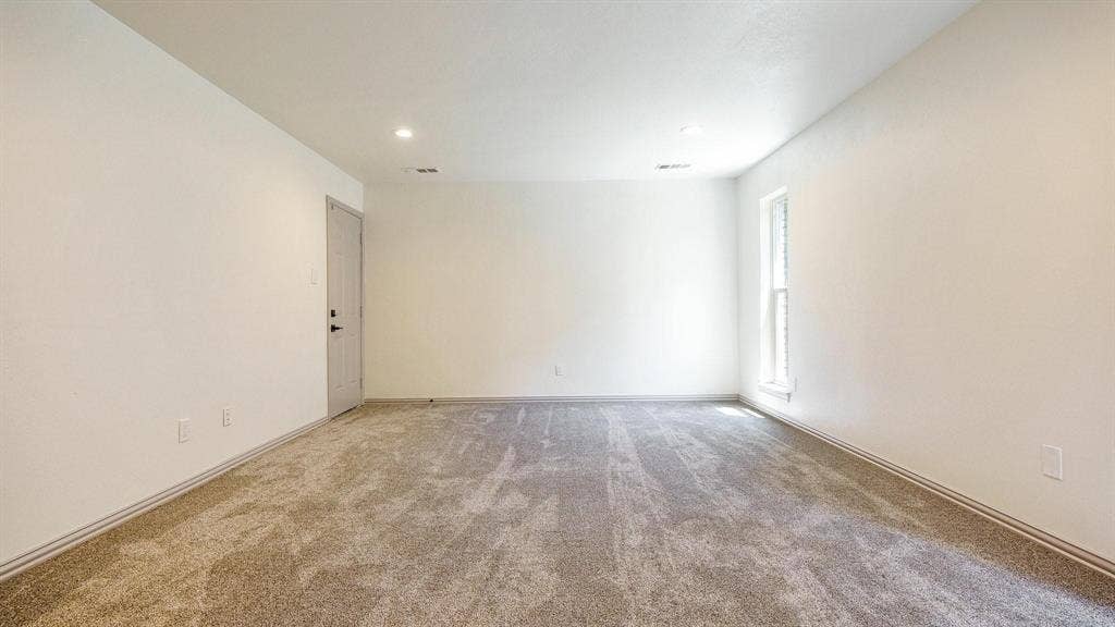 2616 Ellis Court, Plano, TX 75075 Textured carpet flooring, white painted walls, recessed ceiling lighting, and a single window