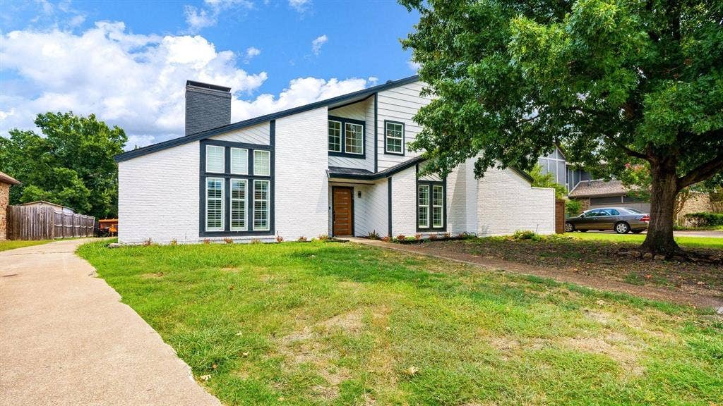 2616 Ellis Court, Plano, TX 75075 Contemporary exterior featuring white brick and dark trim