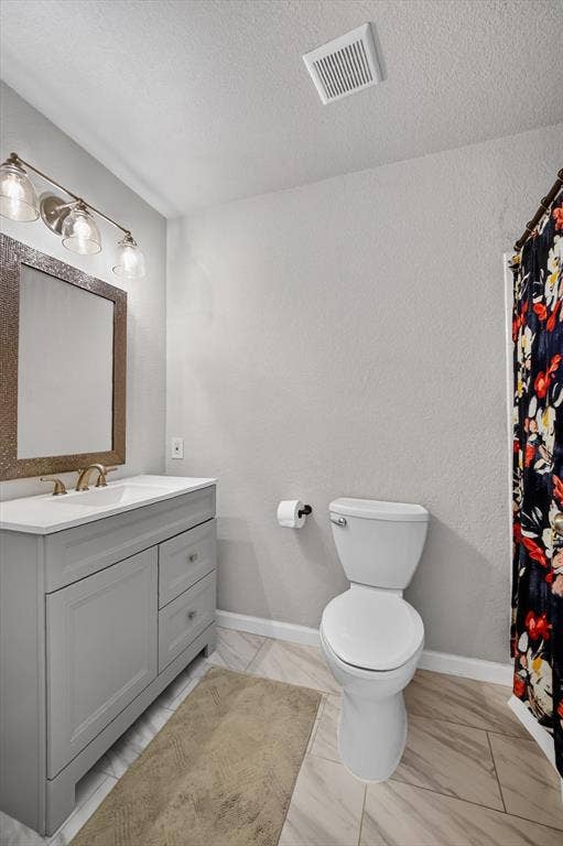 519 Fox Creek Court, Denton, TX 76209 Single vanity with a white countertop, undermount sink, and brushed gold faucet