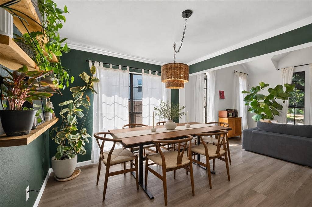 519 Fox Creek Court, Denton, TX 76209 *virtually staged chairs and tablescape* Wood-finish flooring throughout, featuring a layered woven pendant light fixture