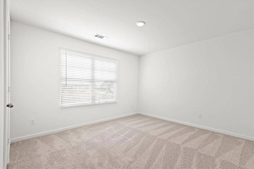 3208 Dillonwood Street, Celina, TX 75009 Neutral-toned carpeting, white painted walls, and a recessed ceiling light