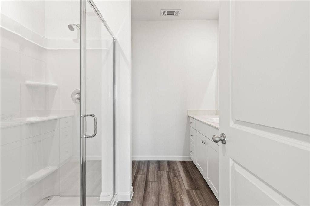 3208 Dillonwood Street, Celina, TX 75009 Glass-enclosed shower with built-in shelving and bench