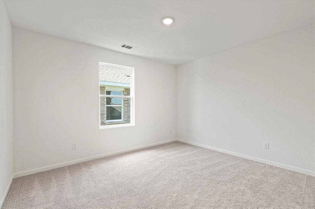 3208 Dillonwood Street, Celina, TX 75009 Recessed ceiling lighting, neutral wall finishes, light-toned carpeting, and a single pane window
