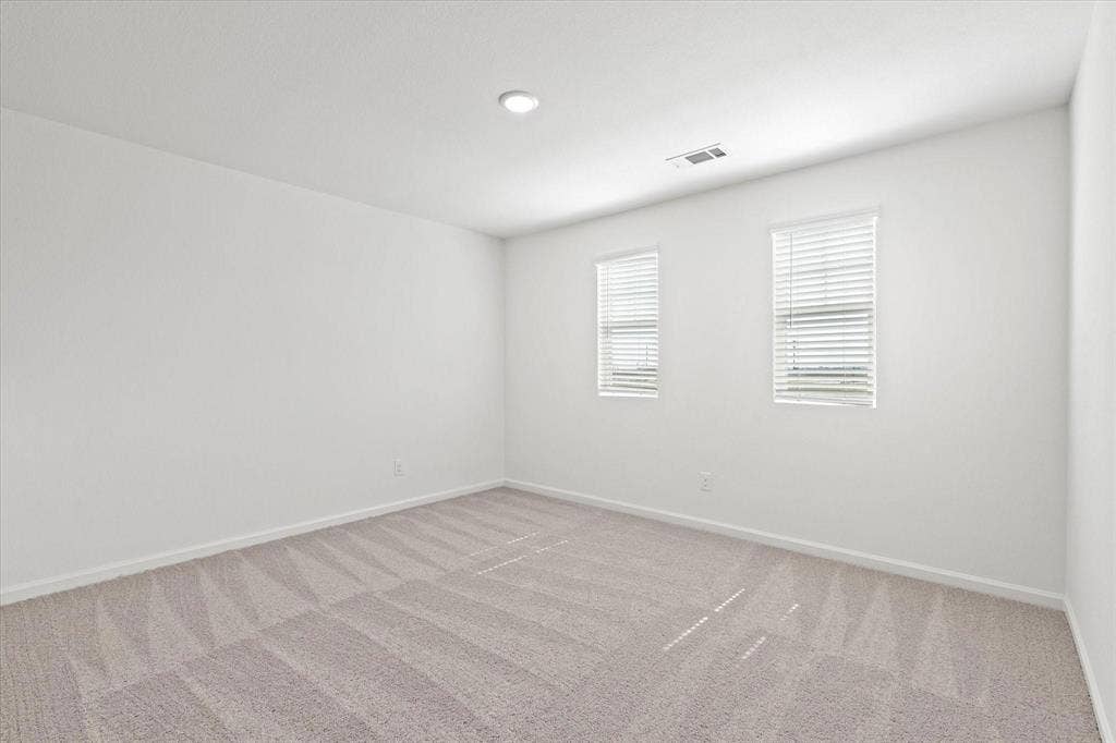 3208 Dillonwood Street, Celina, TX 75009 Neutral tone wall color, recessed ceiling lighting, light-toned patterned carpet, multiple windows with blinds