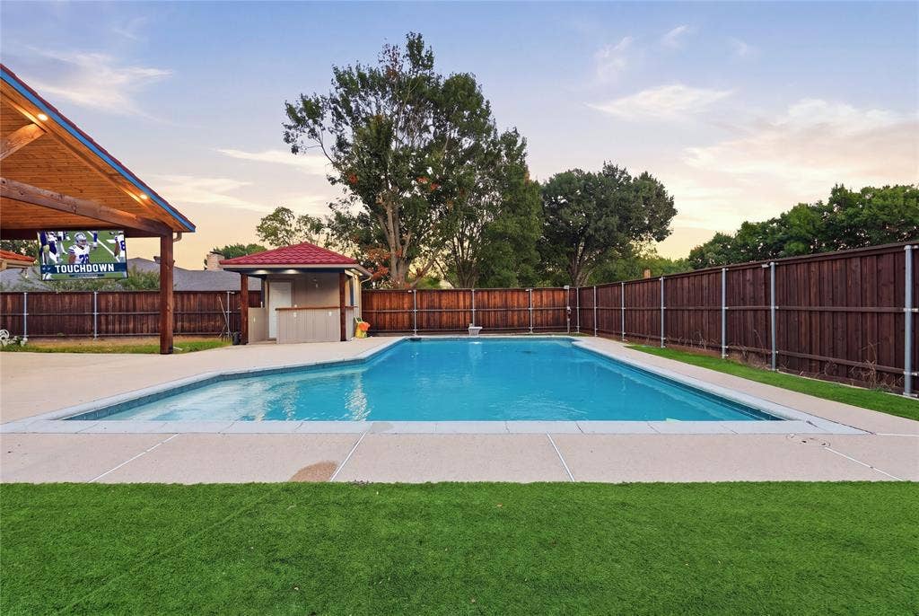 1010 Florence Drive, Duncanville, TX 75116 Expansive inground swimming pool with surrounding concrete decking