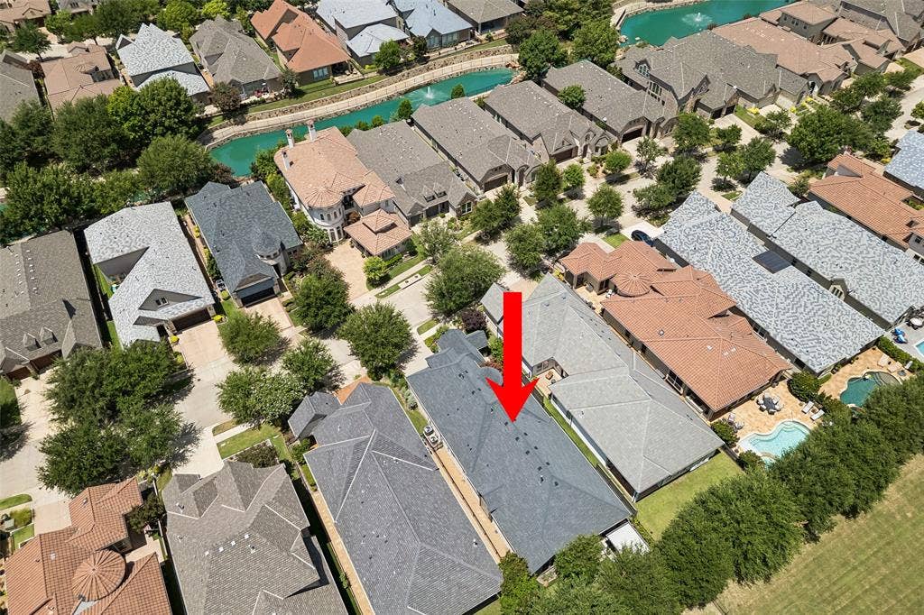 6009 Heron Bay Lane, McKinney, TX 75070 Home backs to a treed fenceline for privacy.