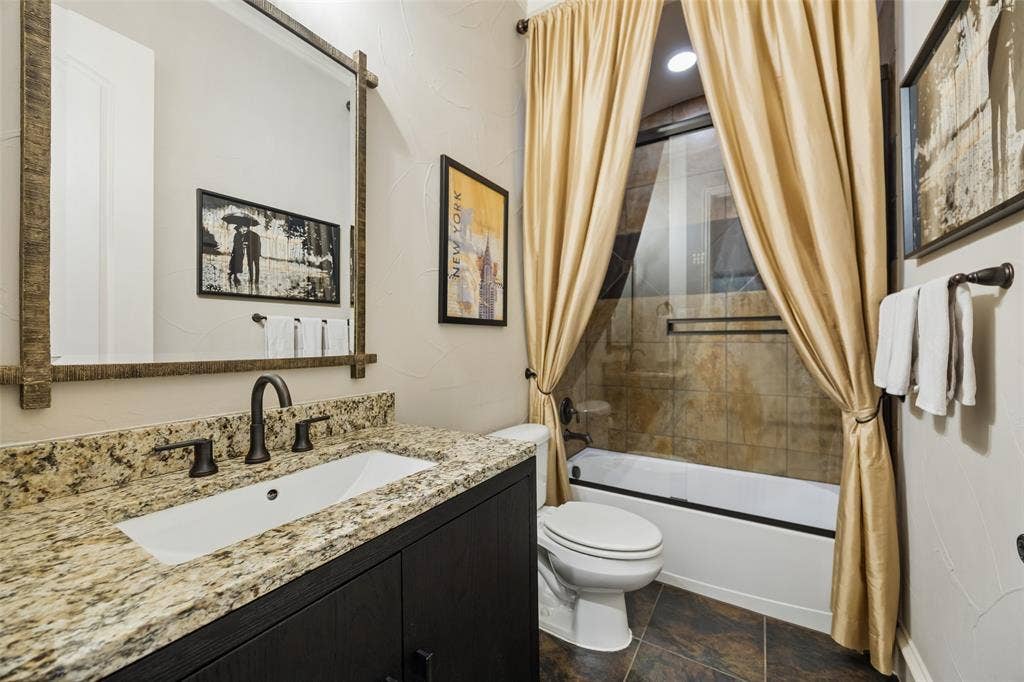 6009 Heron Bay Lane, McKinney, TX 75070 Full bathroom with tub/shower combo.