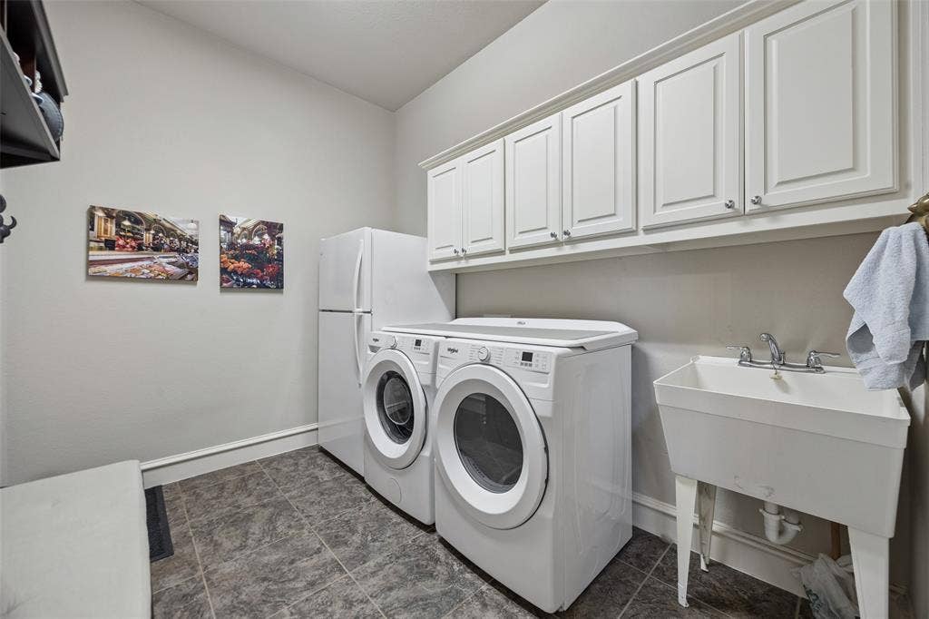 6009 Heron Bay Lane, McKinney, TX 75070 Enhanced laundry area with sink and room for additional refrigerator/freezer or storage.