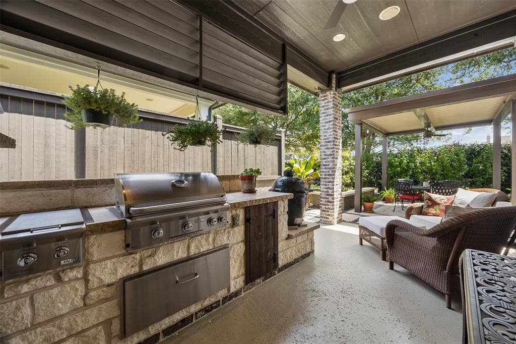6009 Heron Bay Lane, McKinney, TX 75070 Outdoor grill Center and covered seating area.