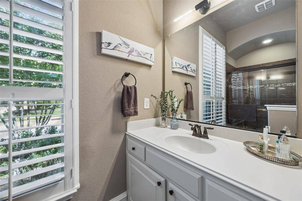 6009 Heron Bay Lane, McKinney, TX 75070 Additional secondary full bathroom with walk in shower.