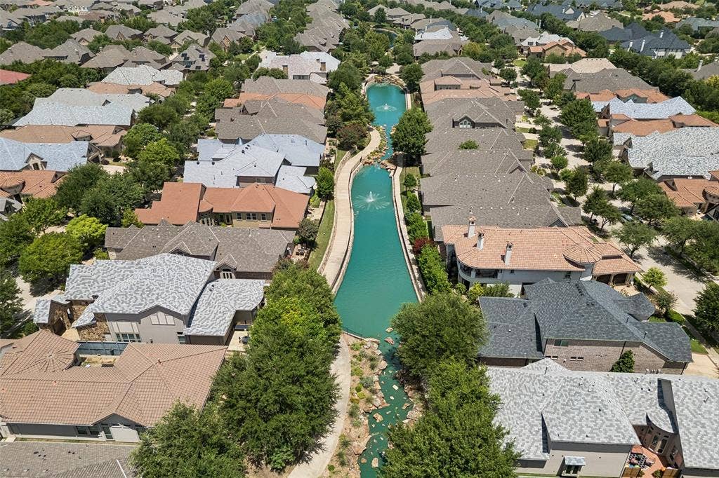 6009 Heron Bay Lane, McKinney, TX 75070 Lighted fountains and canal walking paths.