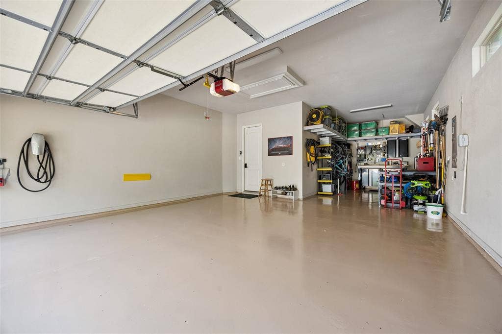 6009 Heron Bay Lane, McKinney, TX 75070 3 car tandem bay garage with built in storage racks.