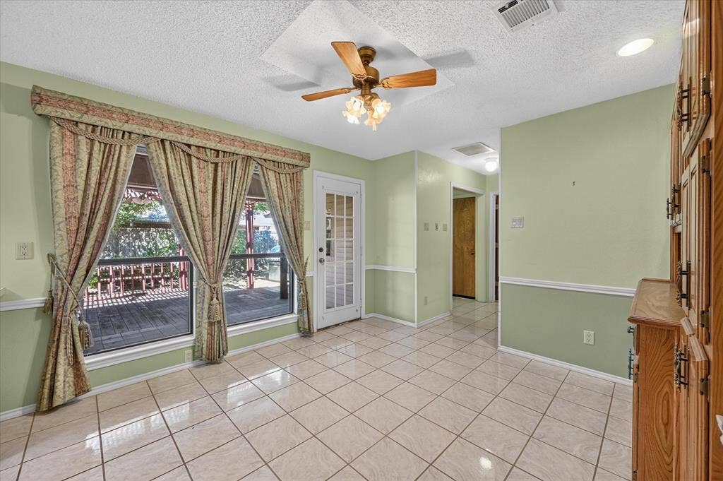 206 Harris Drive, Sunnyvale, TX 75182 Tile flooring, built-in cabinetry, ceiling fan with light fixture, recessed lighting, and a glass-paneled door