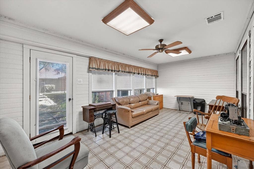 206 Harris Drive, Sunnyvale, TX 75182 Floor-to-ceiling windows with blinds, patterned tile flooring, ceiling fan, recessed lighting, and a glass-paneled door