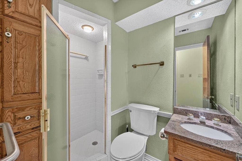 206 Harris Drive, Sunnyvale, TX 75182 White tile shower with frosted glass enclosure